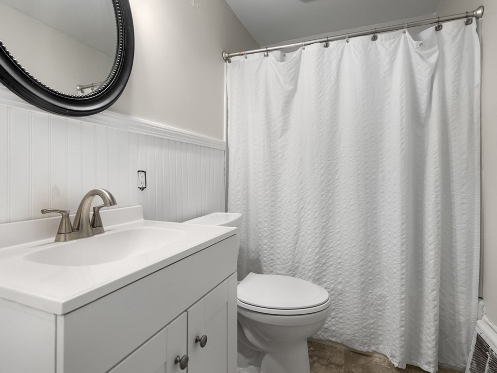 86 Anniversary Street Springfield, MA 01104 - Photo 16 of 31 a bathroom with a sink and a mirror