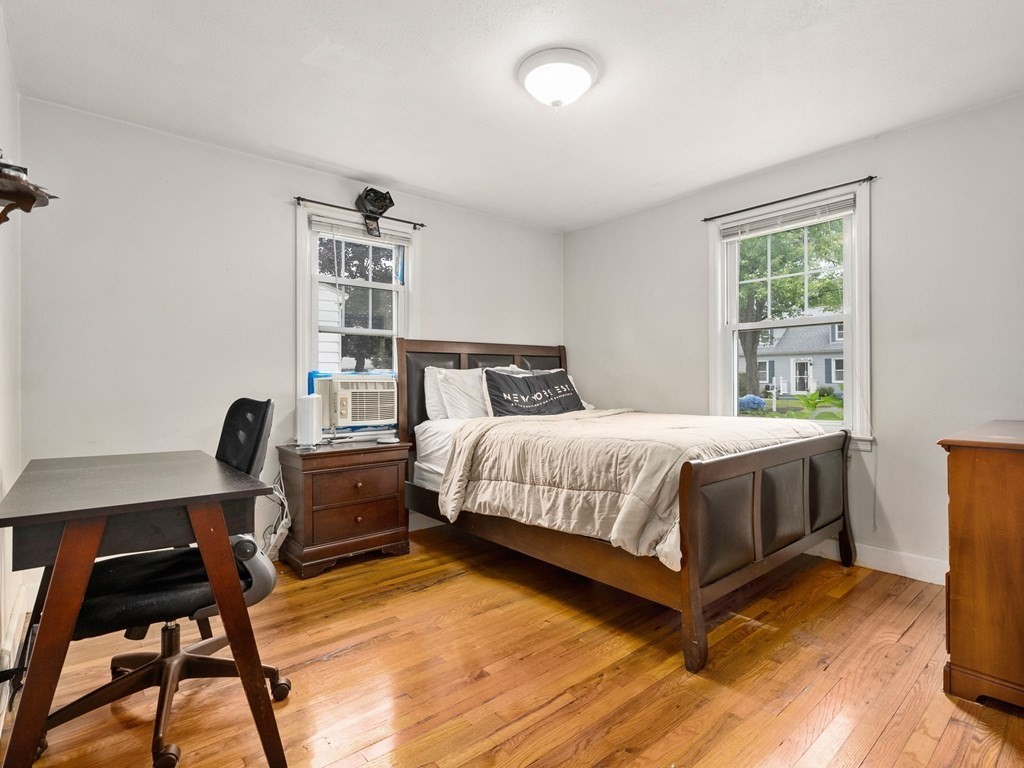 86 Anniversary Street Springfield, MA 01104 - Photo 18 of 31 a bedroom with a bed and a desk in it