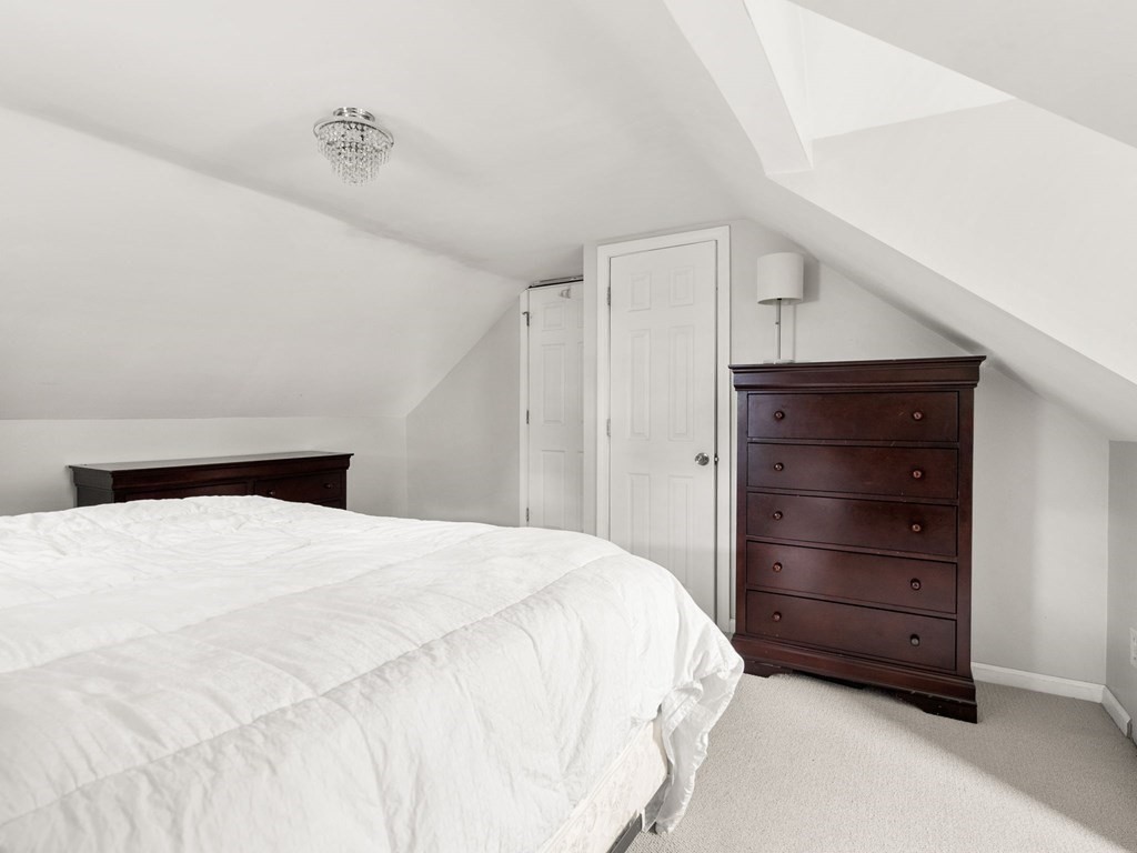 86 Anniversary Street Springfield, MA 01104 - Photo 21 of 31 a bedroom with a bed and a dresser