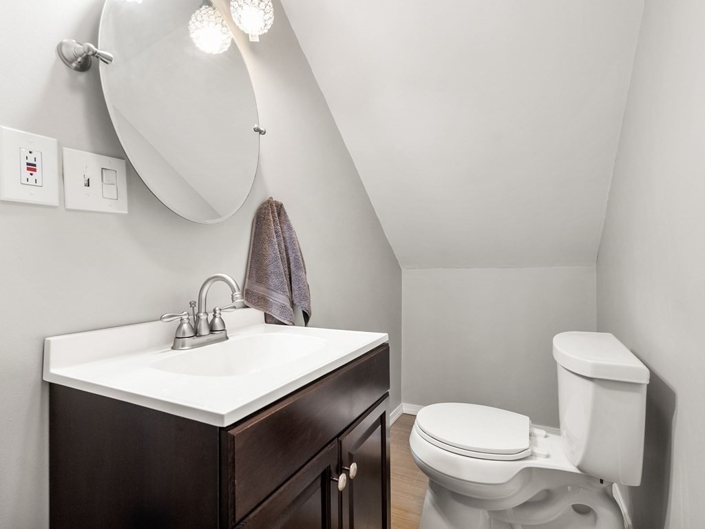 86 Anniversary Street Springfield, MA 01104 - Photo 22 of 31 a bathroom with a sink vanity and a toilet