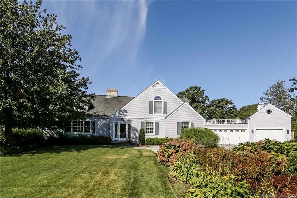 97 Sagamore Road Stamford, CT 06902 - Photo 1 of 1 a front view of a house with a garden