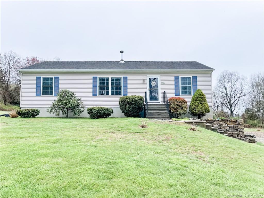 273 Dow Road Plainfield, CT 06374 - Photo 1 of 1 a front view of a house with a garden