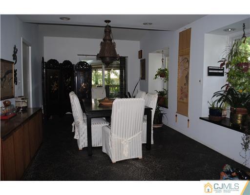 4 Tamarack Road Edison, NJ 08820 - Photo 3 of 19 a view of a dining room with furniture and chandelier