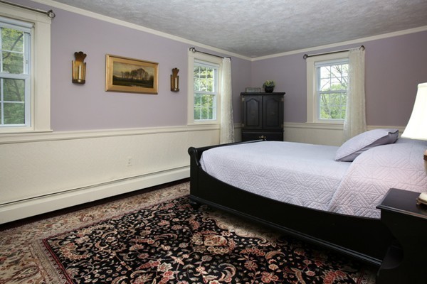 19 Downing Road Lexington, MA 02421 - Photo 6 of 10 a bedroom with a bed and wooden floor