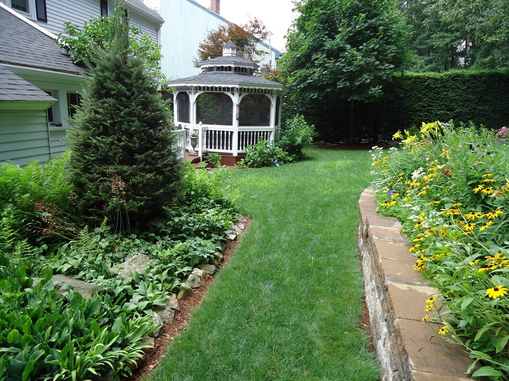 19 Downing Road Lexington, MA 02421 - Photo 8 of 10 a front view of a house with garden