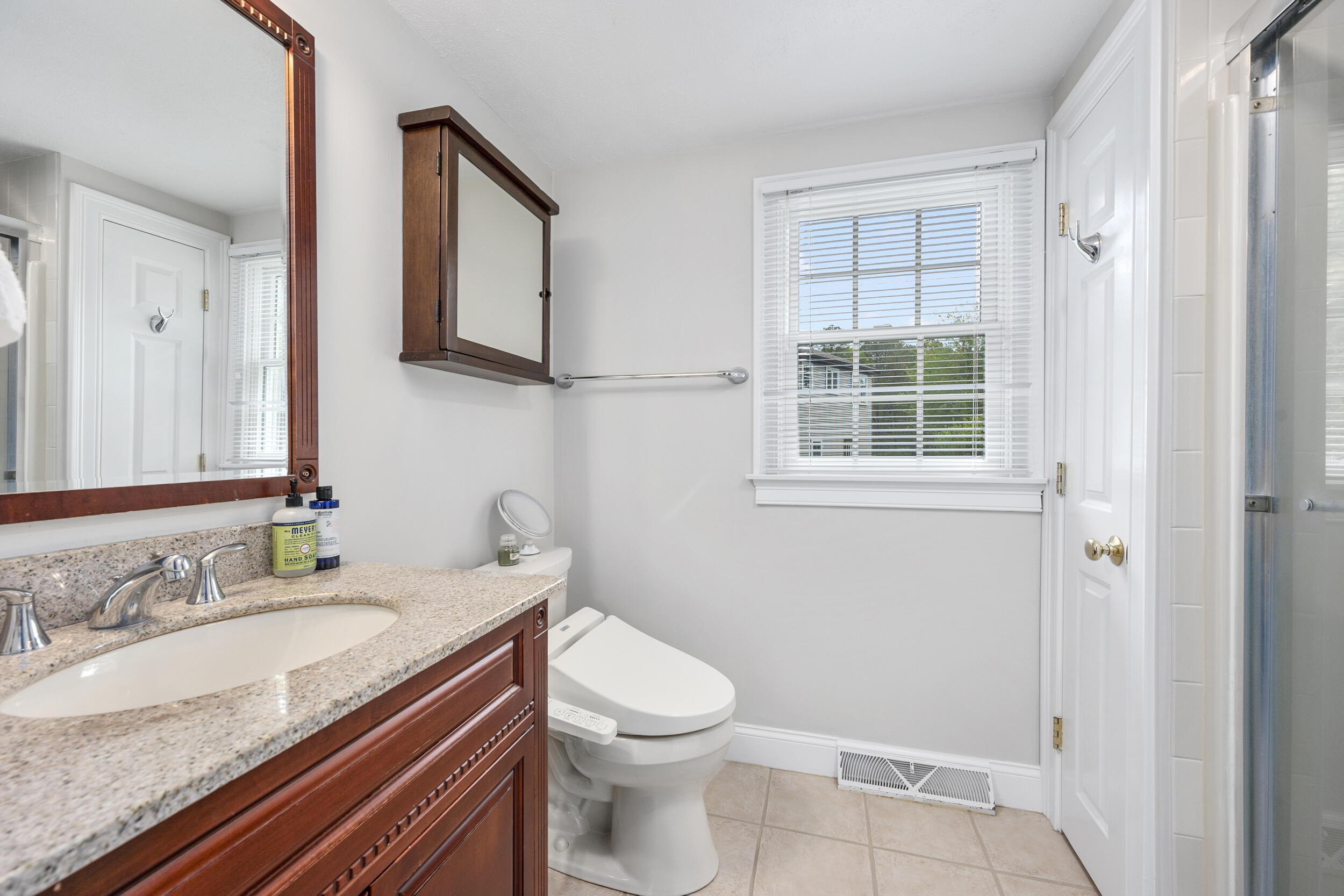 10 Neshobe Road Mashpee, MA 02649 - Photo 16 of 40 a bathroom with a granite countertop sink toilet and shower
