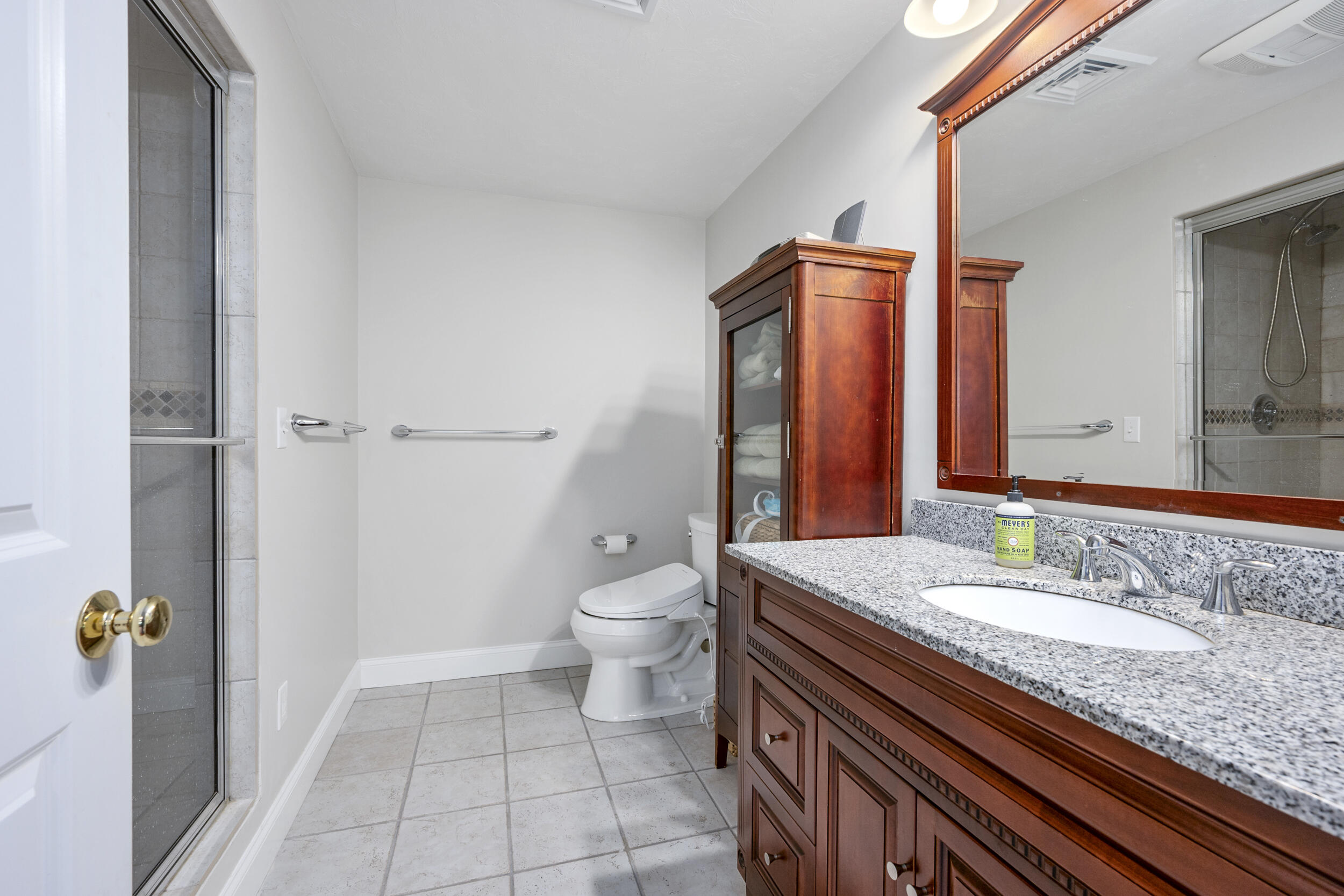 10 Neshobe Road Mashpee, MA 02649 - Photo 19 of 40 a bathroom with a granite countertop sink a toilet and shower