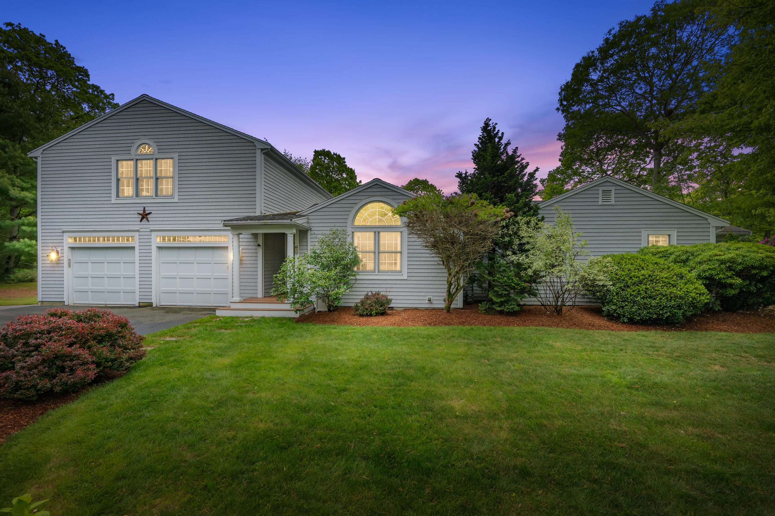 10 Neshobe Road Mashpee, MA 02649 - Photo 2 of 40 a front view of a house with a yard