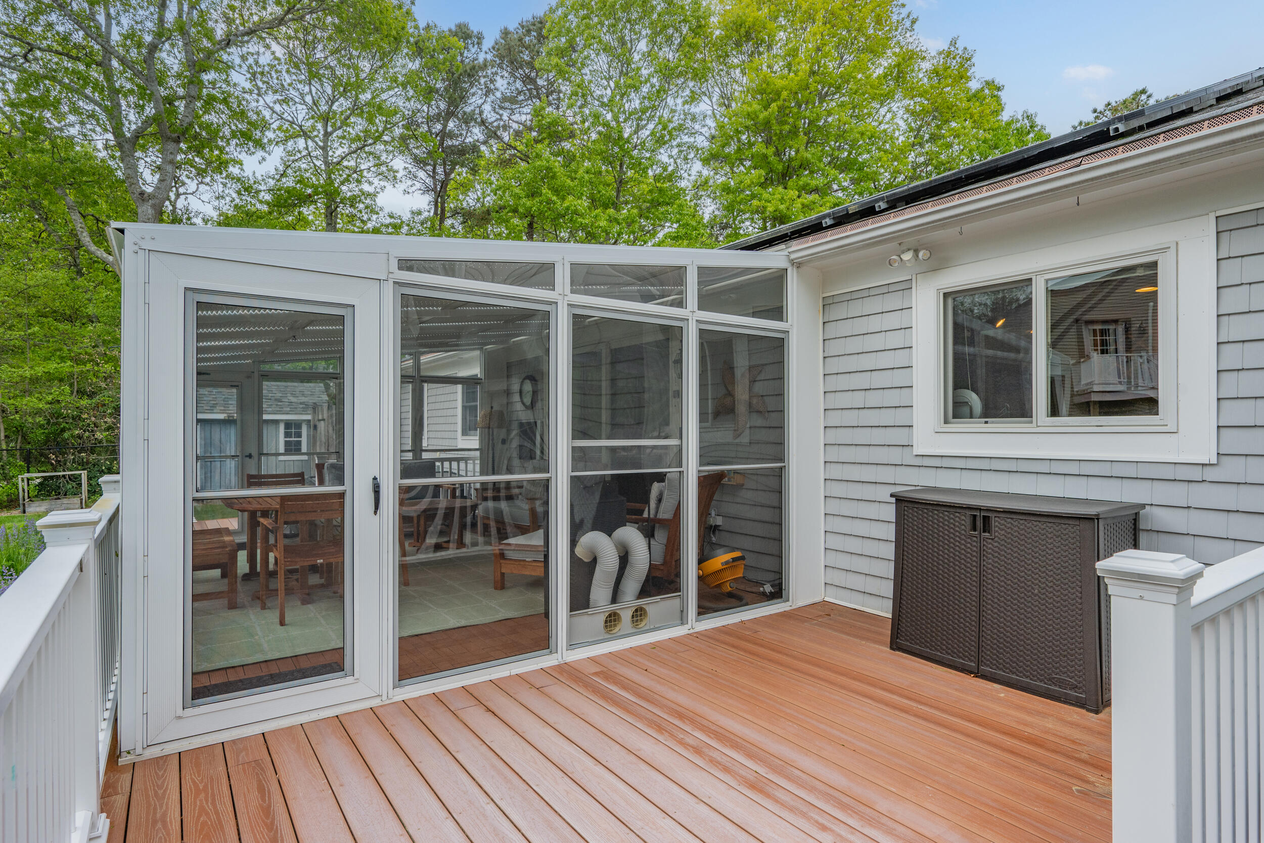 10 Neshobe Road Mashpee, MA 02649 - Photo 26 of 40 a view of a house with a large window and wooden floor