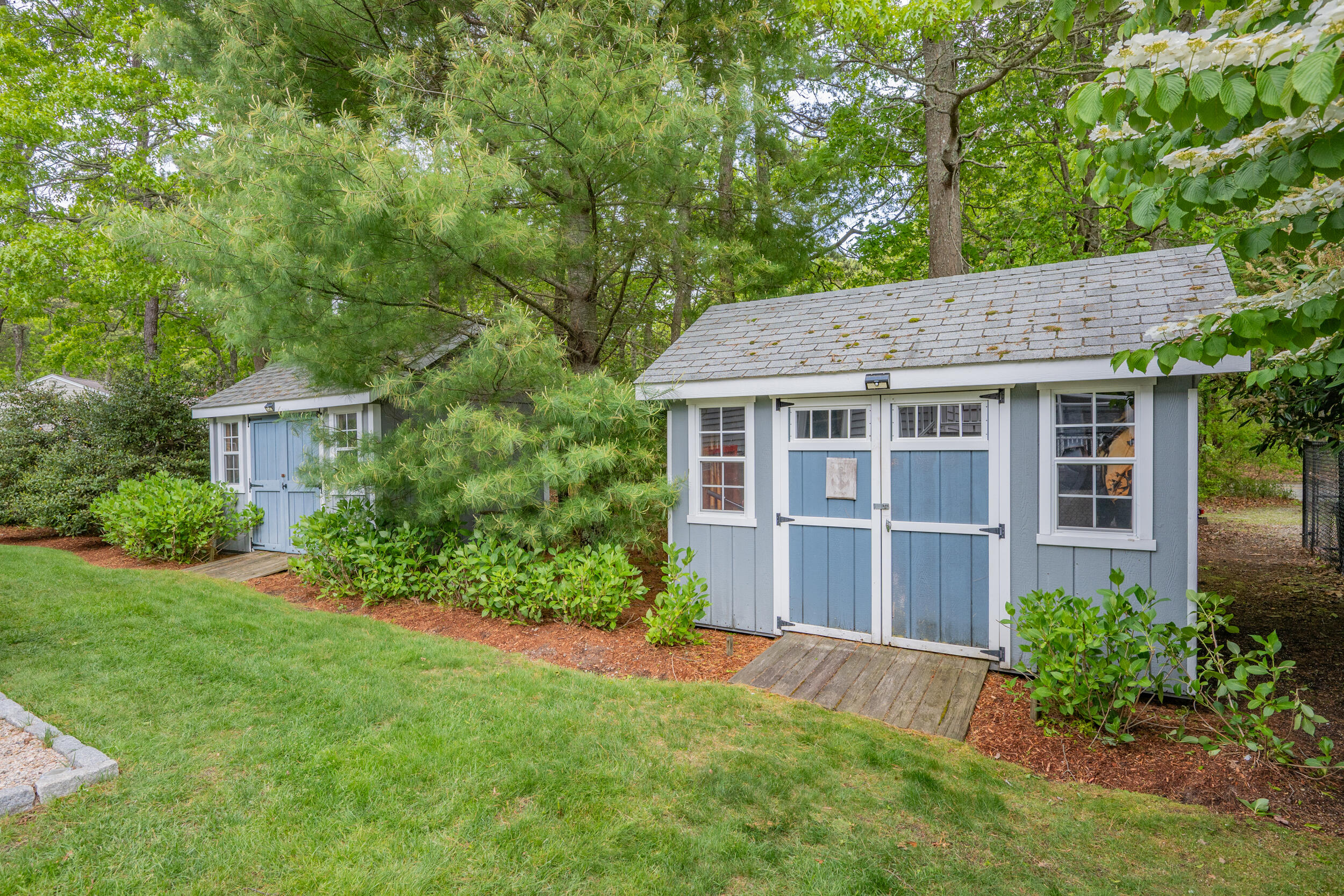 10 Neshobe Road Mashpee, MA 02649 - Photo 30 of 40 a front view of a house with a yard and trees