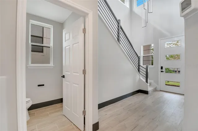 a view of a kitchen with a sink and a refrigerator