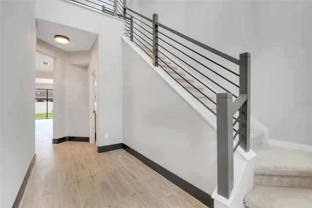 a view of an empty room with glass door