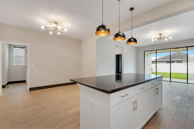 a bathroom with a double vanity sink a mirror and a shower
