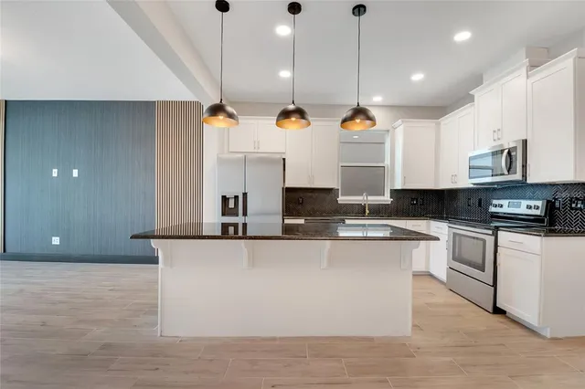 a view of entryway with wooden floor and stairs