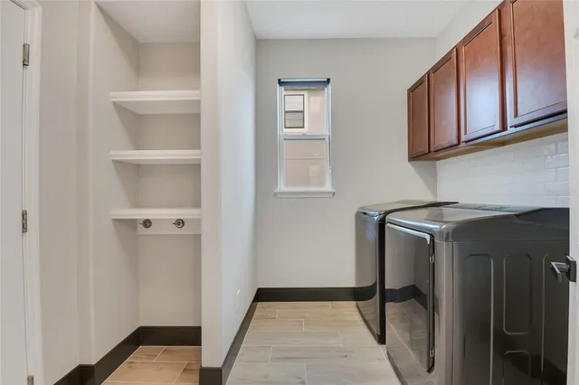 a view of an empty room and a ceiling fan