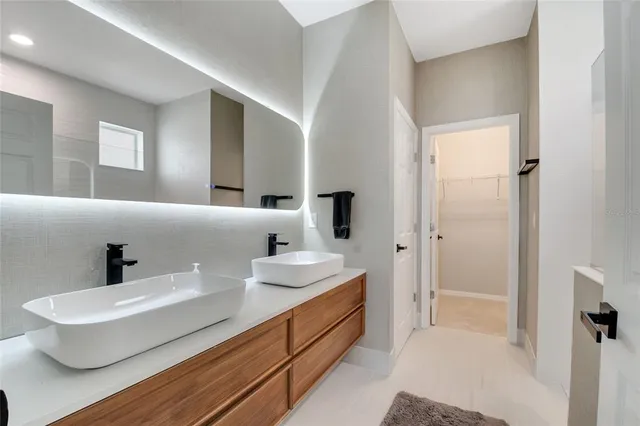 a view of a house with a yard and a fountain