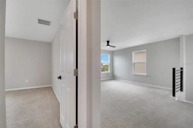 an aerial view of a house with a lake view