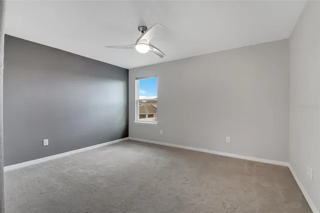an aerial view of residential houses with outdoor space and ocean view