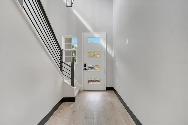 a kitchen with kitchen island granite countertop a sink cabinets and stainless steel appliances