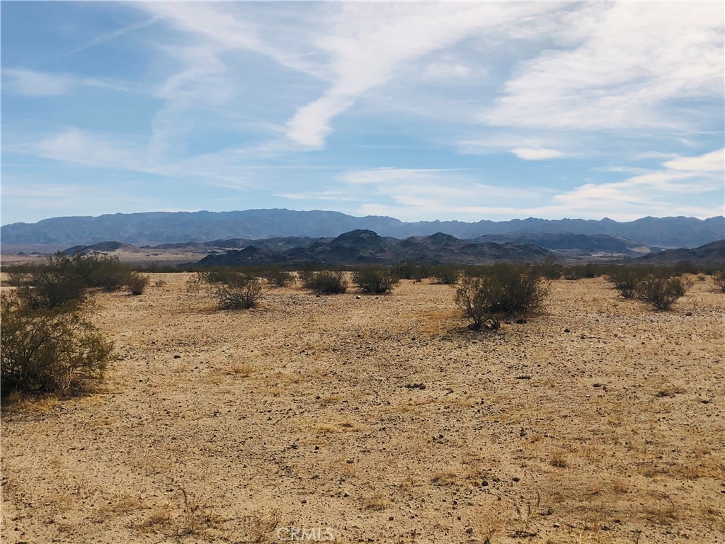 2 Fascination Avenue Joshua Tree, CA 92252 - Photo 2 of 8 a view of a lake with mountain in the background