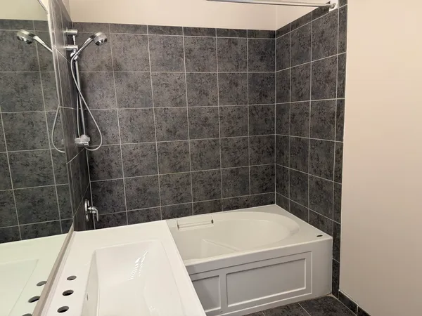 a bathroom with a bath tub
