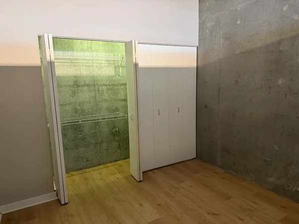 a bathroom with a glass shower door