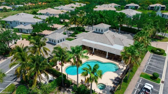 an aerial view of residential house with outdoor space and swimming pool
