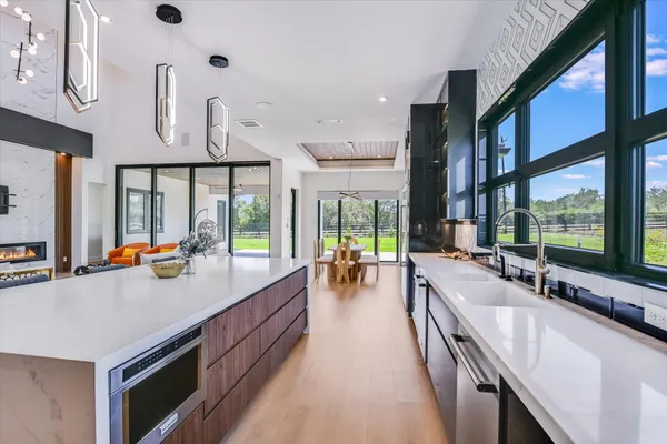 a kitchen with stainless steel appliances lots of counter top space