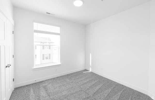 4655 South 720 West, Unit I304 Mapleton, UT 84664 - Photo 7 of 16 Spare room featuring carpet and baseboards