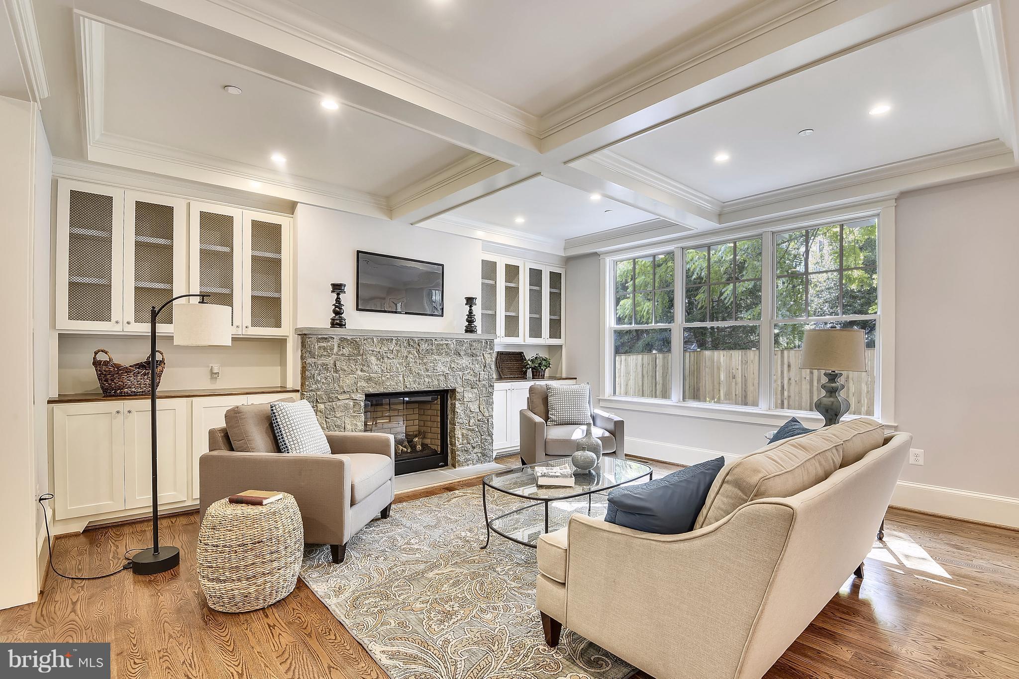 7810 Custer Road Bethesda, MD 20814 - Photo 5 of 30 a living room with furniture and a fireplace