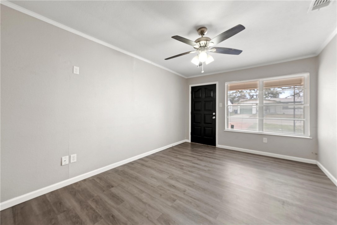 3234 Ferndale Drive Waco, TX 76706 - Photo 13 of 17 a view of an empty room with wooden floor and a window
