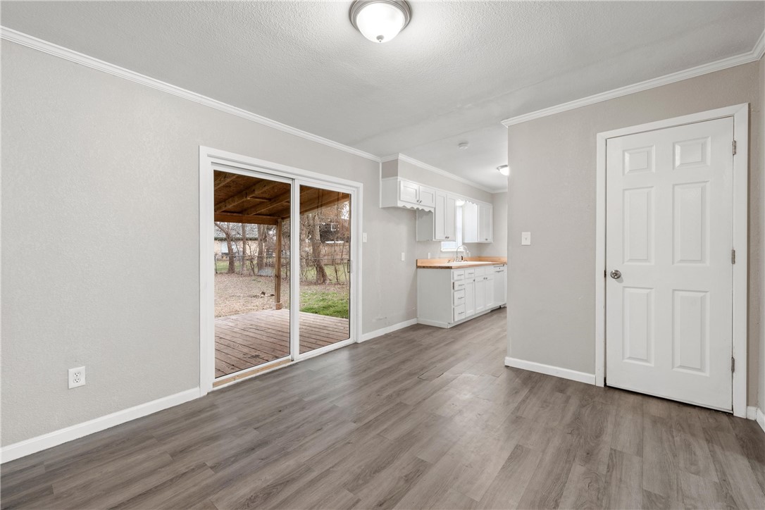 3234 Ferndale Drive Waco, TX 76706 - Photo 3 of 17 a view of a kitchen with wooden floor and a sink