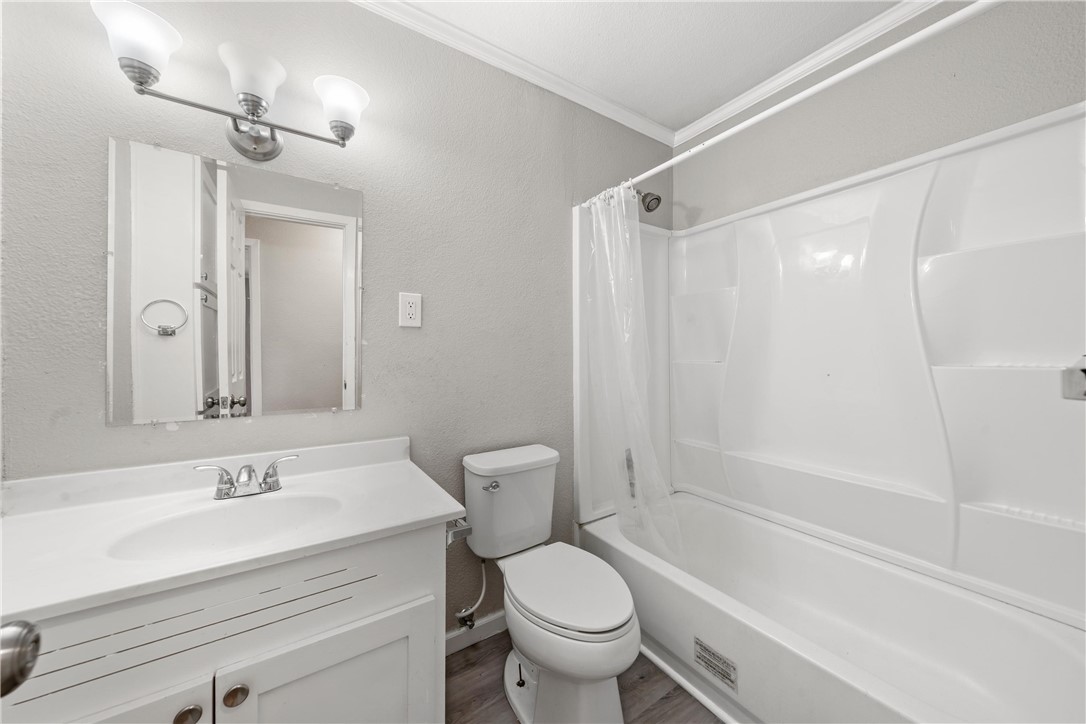 3234 Ferndale Drive Waco, TX 76706 - Photo 8 of 17 a bathroom with a sink toilet and shower