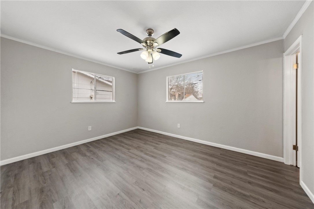 3234 Ferndale Drive Waco, TX 76706 - Photo 9 of 17 a view of an empty room with wooden floor and a window