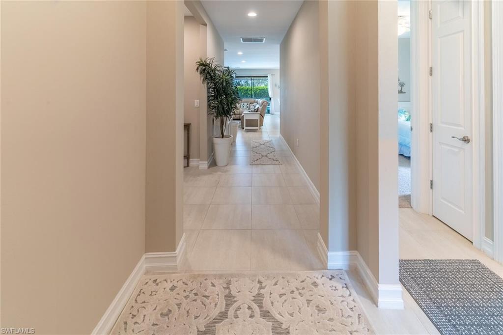16366 Barclay Court Naples, FL 34110 - Photo 22 of 35 wooden floor with a window