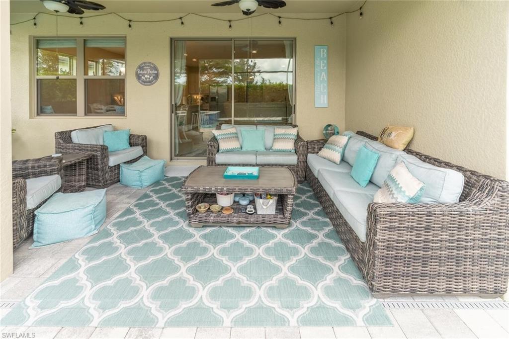 16366 Barclay Court Naples, FL 34110 - Photo 30 of 35 a living room with furniture and a large window