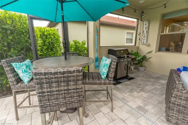 a view of an chairs and table in the patio