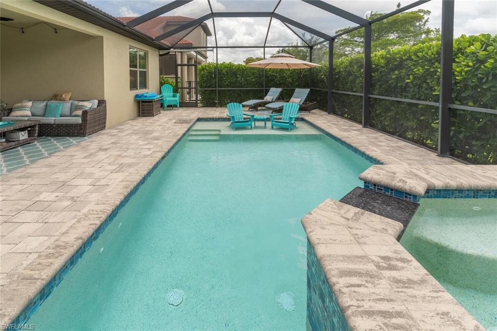 16366 Barclay Court Naples, FL 34110 - Photo 32 of 35 a view of a patio with chairs next to a yard
