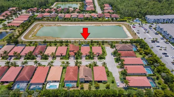 a view of swimming pool with a yard and seating area