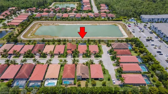 a view of swimming pool with a yard and seating area