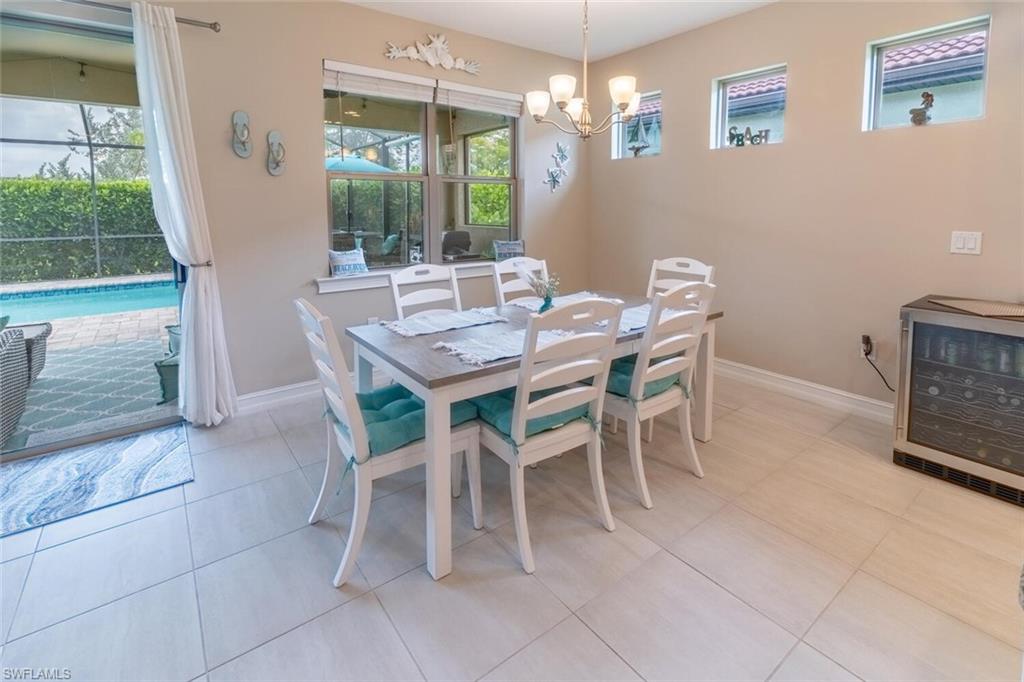 16366 Barclay Court Naples, FL 34110 - Photo 9 of 35 a view of a dining room with furniture window and outside view