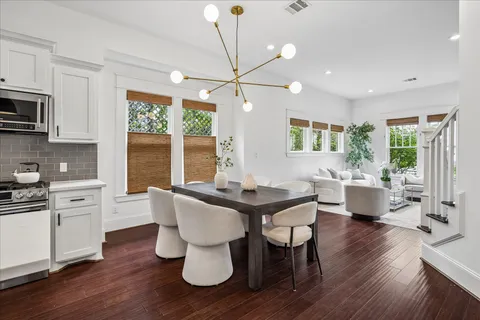a bathroom with a granite countertop sink toilet a mirror and shower