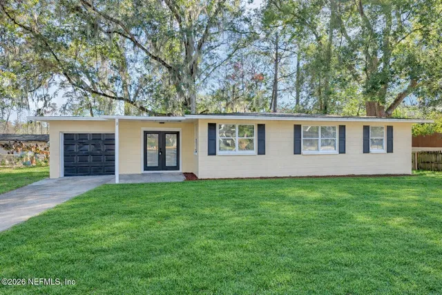 front view of a house with a yard