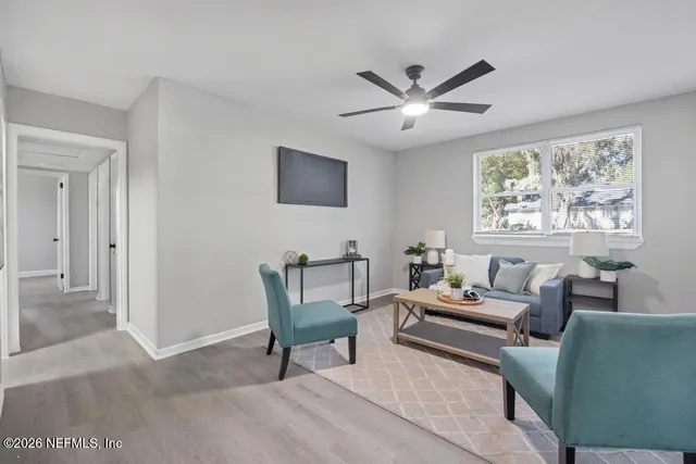 a living room with furniture and a window