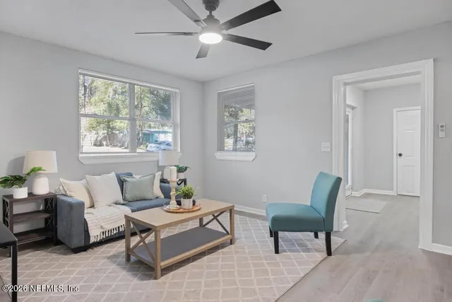 a living room with furniture and a window