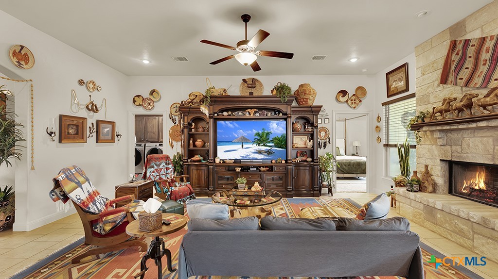343 Meadow Valley Loop Jarrell, TX 76537 - Photo 29 of 33 a living room with furniture and a fireplace
