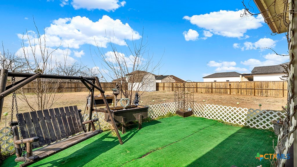 343 Meadow Valley Loop Jarrell, TX 76537 - Photo 30 of 33 a view of a porch with a yard