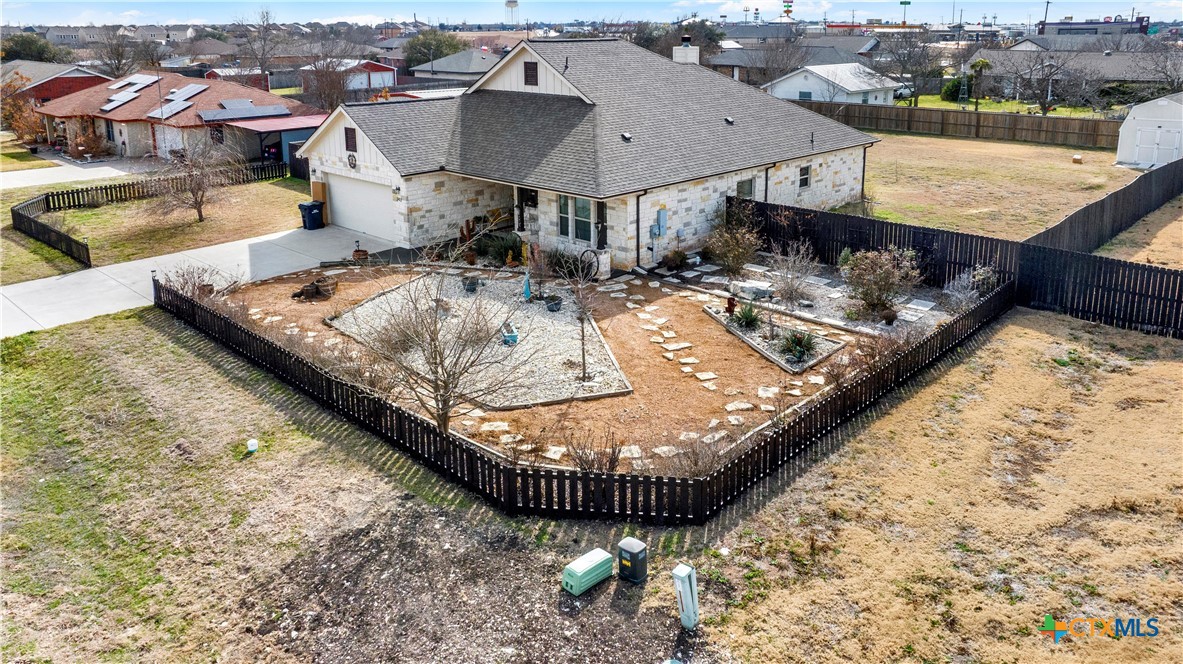 343 Meadow Valley Loop Jarrell, TX 76537 - Photo 3 of 33 an aerial view of a house with a swimming pool