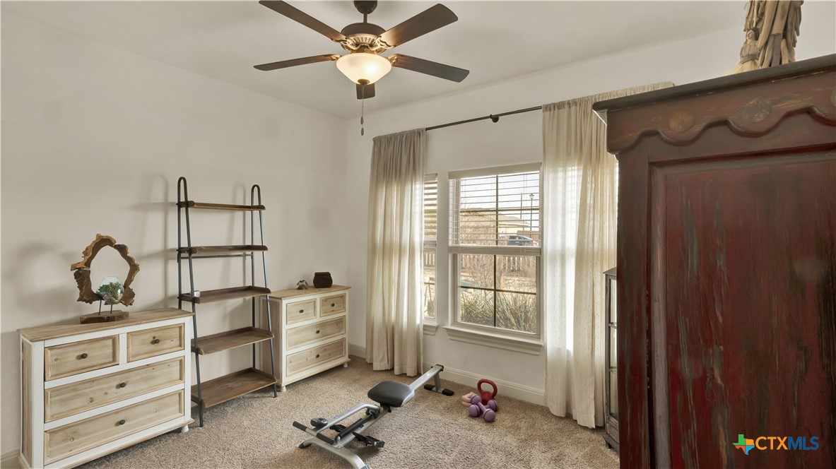343 Meadow Valley Loop Jarrell, TX 76537 - Photo 5 of 33 a room with cabinets and window