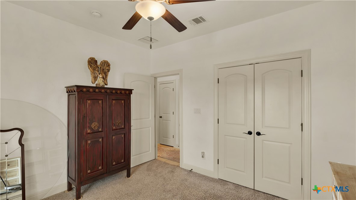 343 Meadow Valley Loop Jarrell, TX 76537 - Photo 6 of 33 a view of a hallway with a chandelier